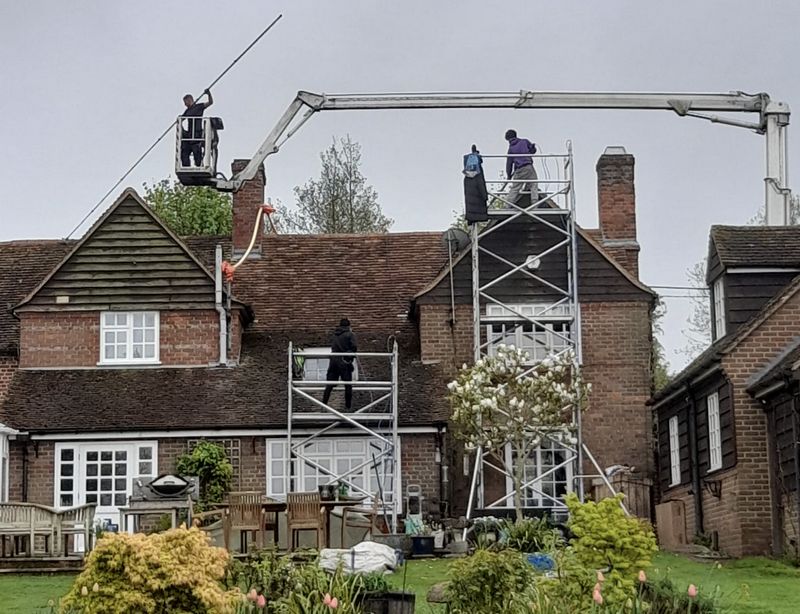 The Roof Moss Cleaners using cherry picker and scaffolding to clean roof safely and professionally in Broxbourne, Hertfordshire