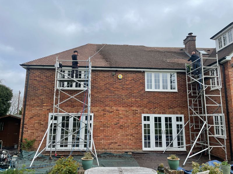 Roof cleaning carried out safely from scaffold towers by The Roof Moss Cleaners in Broxbourne